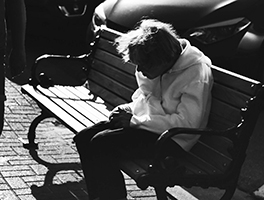 Elderly Woman Sitting on Bench
