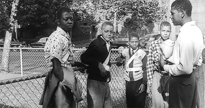 Black boys standing outside in 1951