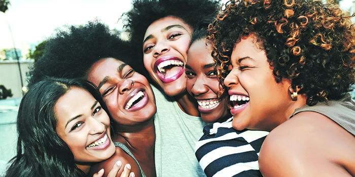 Five black women smiling